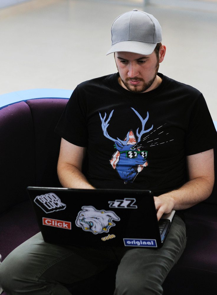 Man on laptop in lap